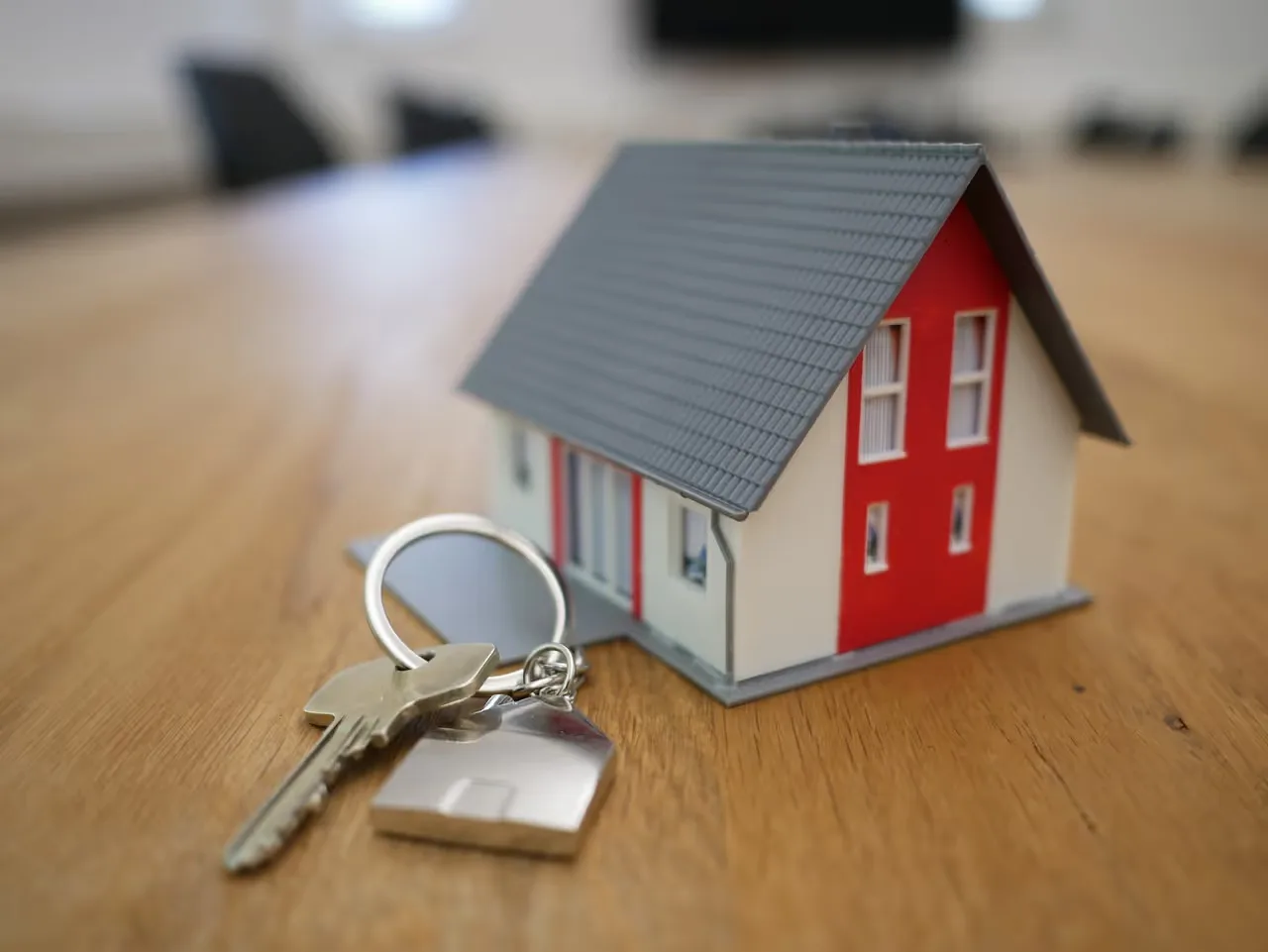 a key and minature house